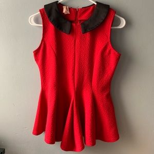 Red peplum sleeveless blouse